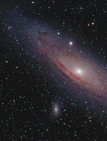 A red spiral galaxy in a sea of stars