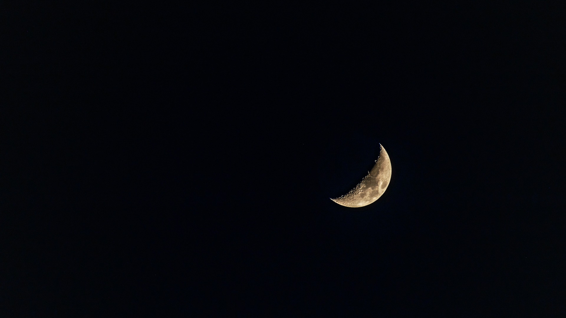 A golden crescent moon