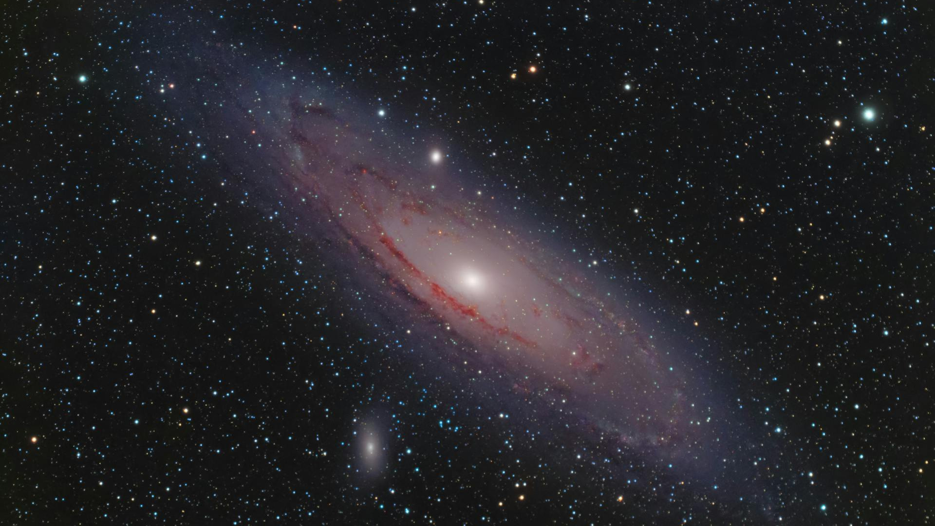 A red spiral galaxy in a sea of stars