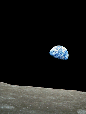 Earth rising above the Moon's horizon