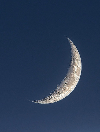 A silvery crescent moon